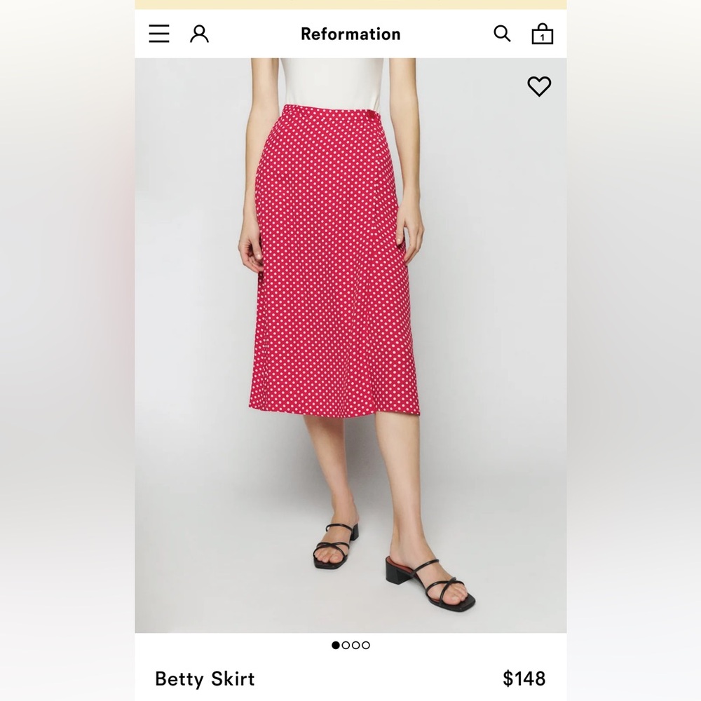 Reformation Betty Skirt in size 4, color: Becky Dot.
Wrap around midi skirt.